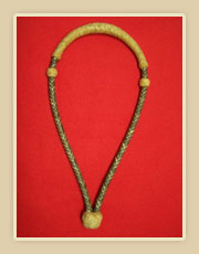 Rawhide bosal, dark body with natural color nose button and heal knot