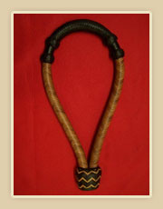 Harness leather, light body with dark nose button and heal knot 
