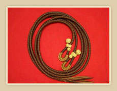 7 1/2 ft. Braided Latigo split reins, with Rawhide knots and quick detachable ends.