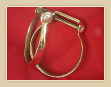Brass oxbow sturps with sterling silver conch