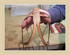 Double eared bosal hanger with rawhide lacing and knots