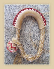 Rawhide honda with colored string.