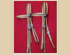 Plain brow band headstall with fancy buckles and rosettes