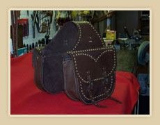 Harness leather saddle bags, with brass spots