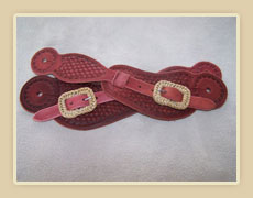 Spur straps with rawhide covered buckles