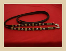Reins with turquoise star conchos and rawhide braiding