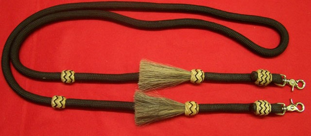 Poly roping rein with horse hair tassles and rawhide knots with color string and sissor snaps