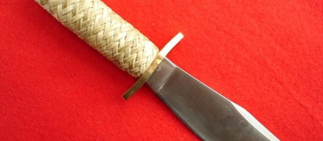 Braided rawhide knife handle, solingen steel blade.