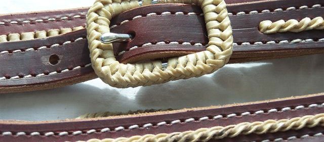 Rawhide braided buckle and rawhide accents.