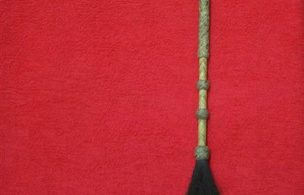 Rawhide quirt with horse hair.